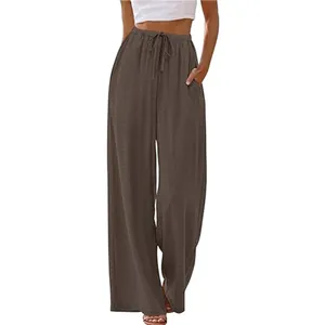Casual brown wide leg trousers with drawstring waist and side pockets for beach