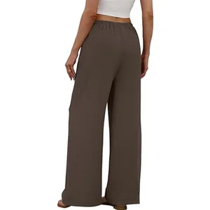 Rear view detail of women's brown wide-leg pants with elastic waist and textured fabric