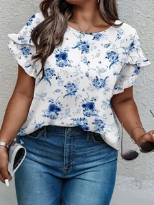 Close-up detail of blue floral print blouse featuring elegant ruffle sleeves for women