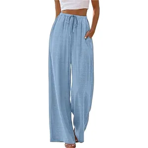Casual light blue wide-leg pants featuring an elastic drawstring waist and side pockets