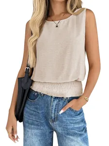 Close-up of beige sleeveless top with smocked waist detail and textured fabric.
