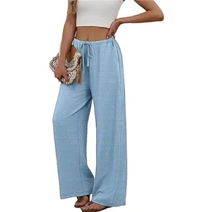 Women's light blue wide leg pants with elastic drawstring waist and side pockets