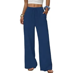 Detail view of navy blue wide-leg pants with elastic drawstring waist and side pockets