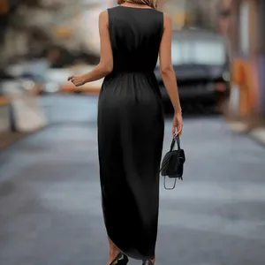Back view of elegant black satin sleeveless maxi dress with irregular hem and side slit