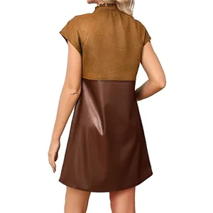 Back view of faux suede and PU leather patchwork mini dress showing material contrast