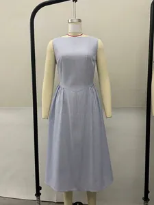 Blue and white vertical striped sleeveless dress on a mannequin display