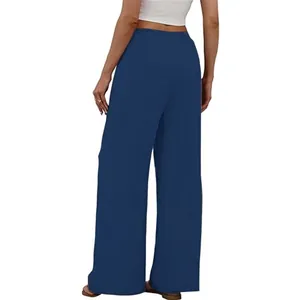 Back view of women's navy blue wide-leg pants with comfortable elastic waistband