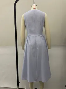 Rear view of a sleeveless blue and white vertical striped midi dress on a mannequin.