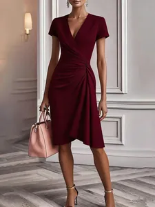 Elegantly pleated burgundy V-neck wrap dress with a bodycon silhouette and short sleeves
