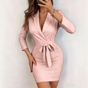 Elegant pink blazer dress with waist tie and 3/4 sleeves shown in close-up