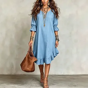 Bohemian style light blue woven midi dress featuring elegant ruffle hem and mid-length sleeves