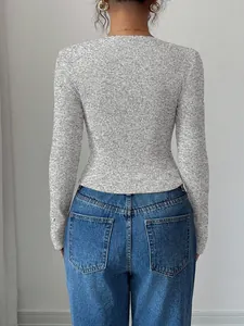 Detailed back view of a women's slim fit grey ribbed knit long sleeve shirt for 2025 fashion