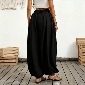 Back view of comfortable high waist black lantern pants for casual beach vacation.