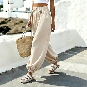 Beige high-waisted lantern pants with pockets for a comfortable beach vacation look