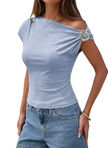 Close-up of asymmetrical one-shoulder ribbed top with gold heart-shaped buckle detail