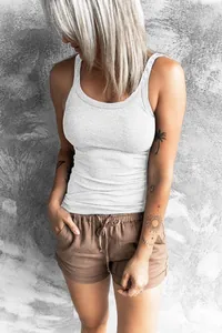 Close-up of white ribbed slim-fit tank top with a scoop neck design.