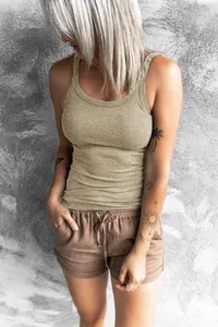 Detailed view of women's slim fit khaki ribbed tank top showing texture and fit.
