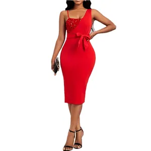 Close-up of red one-shoulder sequin dress with elegant bow belt for evening events