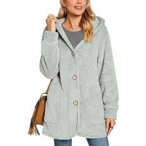 Close-up of women's gray fuzzy hooded cardigan with large buttons and front pockets.