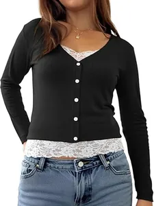 Detail view of black ribbed top featuring white lace trim and white button front closure