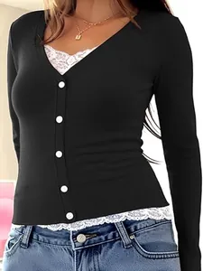 Detail of women's black V-neck long sleeve top with white lace hem and button front.