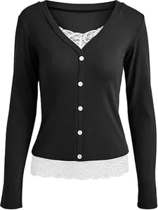 Close-up detail of a black ribbed V-neck long-sleeved top with white lace patchwork and buttons