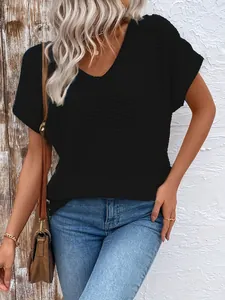 Detailed macro view of waffle knit texture on women's black V-neck short-sleeved T-shirt