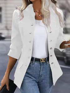 Detail view of a white round neck blazer with decorative silver buttons and faux pockets.