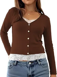Close-up detail of brown ribbed long sleeve top with buttons and white lace trim