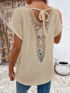 Back view of apricot crochet lace hollow-out short sleeve top with V-neck tie detail