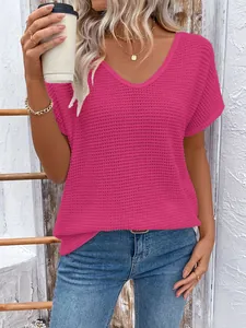 Close-up of pink waffle knit V-neck T-shirt with textured fabric detail
