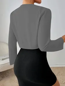Detailed back view of a grey slim fit short suit jacket for women with long sleeves