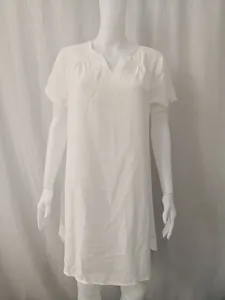 Front view of minimalist white cotton linen short sleeve loose casual dress on mannequin