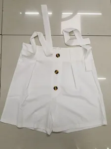 White high-waisted wide-leg shorts with front buttons and adjustable tie straps
