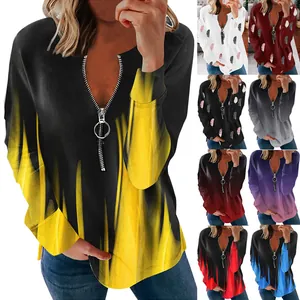 Elegante maglia a maniche lunghe da donna con scollo a V, zip e stampe sfumate colorate.
