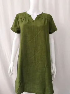 Detail showing the olive green woven texture and V-neckline of this cotton linen dress