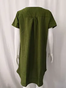 Back view of a casual minimalist green cotton linen short sleeve dress with pleated detail