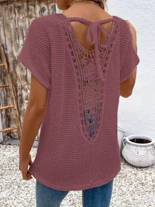 Detailed back view of women's mauve short sleeve top with elegant lace hollow out design