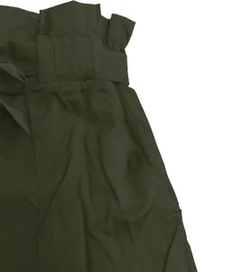 Close-up of olive green high-waisted shorts with a paper-bag waist and tie belt