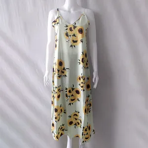 Bohemian summer slip dress with yellow sunflower print, front view on white mannequin