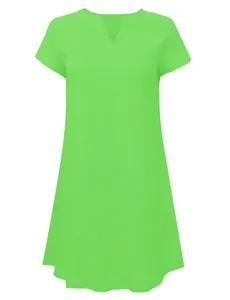 Detailed view of a bright lime green loose spring summer woven dress with V-neckline