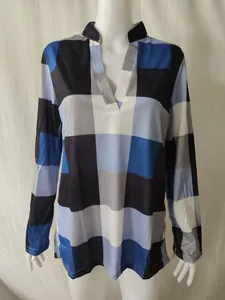 Women's blue and black checkered long-sleeve blouse with stylish V-neck collar.