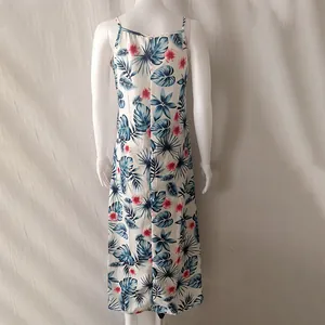 Back view of a summer tropical leaf print cami dress displayed on a white mannequin