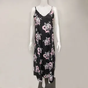 Full-length detail of black floral print maxi camisole dress displayed on mannequin