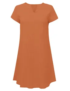 Close-up of the breathable woven fabric and minimalist V-neck design on orange dress