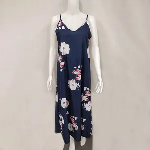Elegant navy blue floral print maxi slip dress shown on a mannequin for summer vacation
