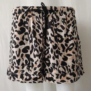 Detailed view of high-waisted leopard print casual shorts featuring elastic drawstring waist