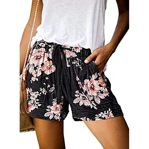 Close-up of the floral print pattern and drawstring waist on casual summer shorts