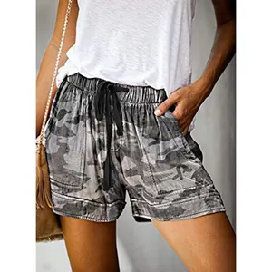 Detail view showing the camouflage print texture and drawstring on high-waist casual shorts.