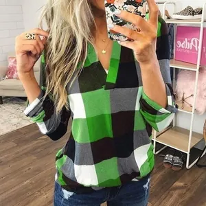 Detailed view of a stylish green and black plaid V-neck long sleeve blouse for women